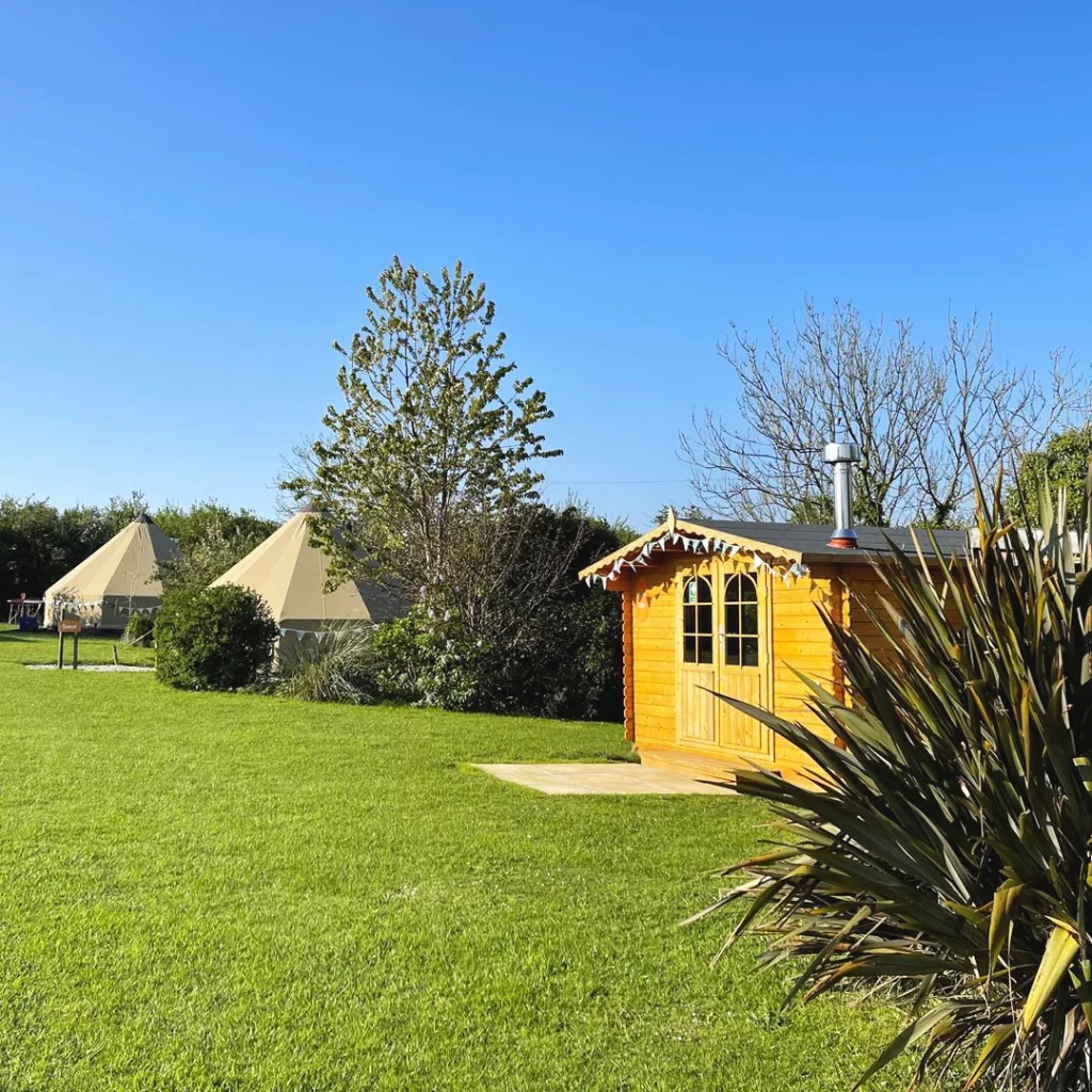 Surfside Social Cabin, with our beautiful bell tents in the distance